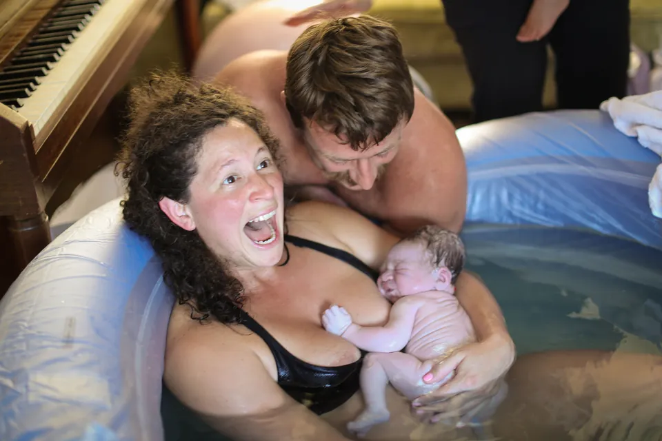 A mother's joy the moment her baby arrives in the birth pool